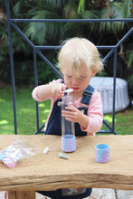 Load image into Gallery viewer, Child playing with Calm Down Bottle - Unicorn
