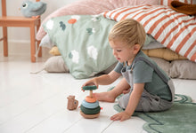 Load image into Gallery viewer, Boy playing with Done by Deer Raffi Stacking Tower
